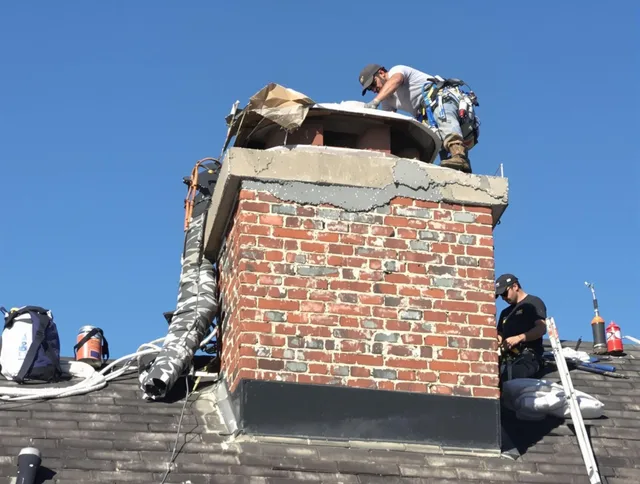 Stanton Chimney Sweep installing a custom chimney crown in Stanton, CA