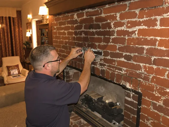 Stanton Chimney Sweep expert fixing a fireplace in Stanton, CA